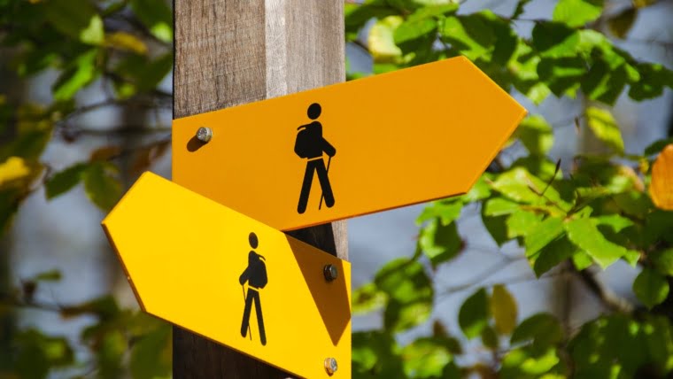 yellow road signage at daytime