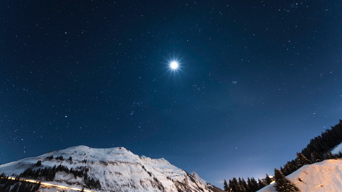 white mountain under starry night